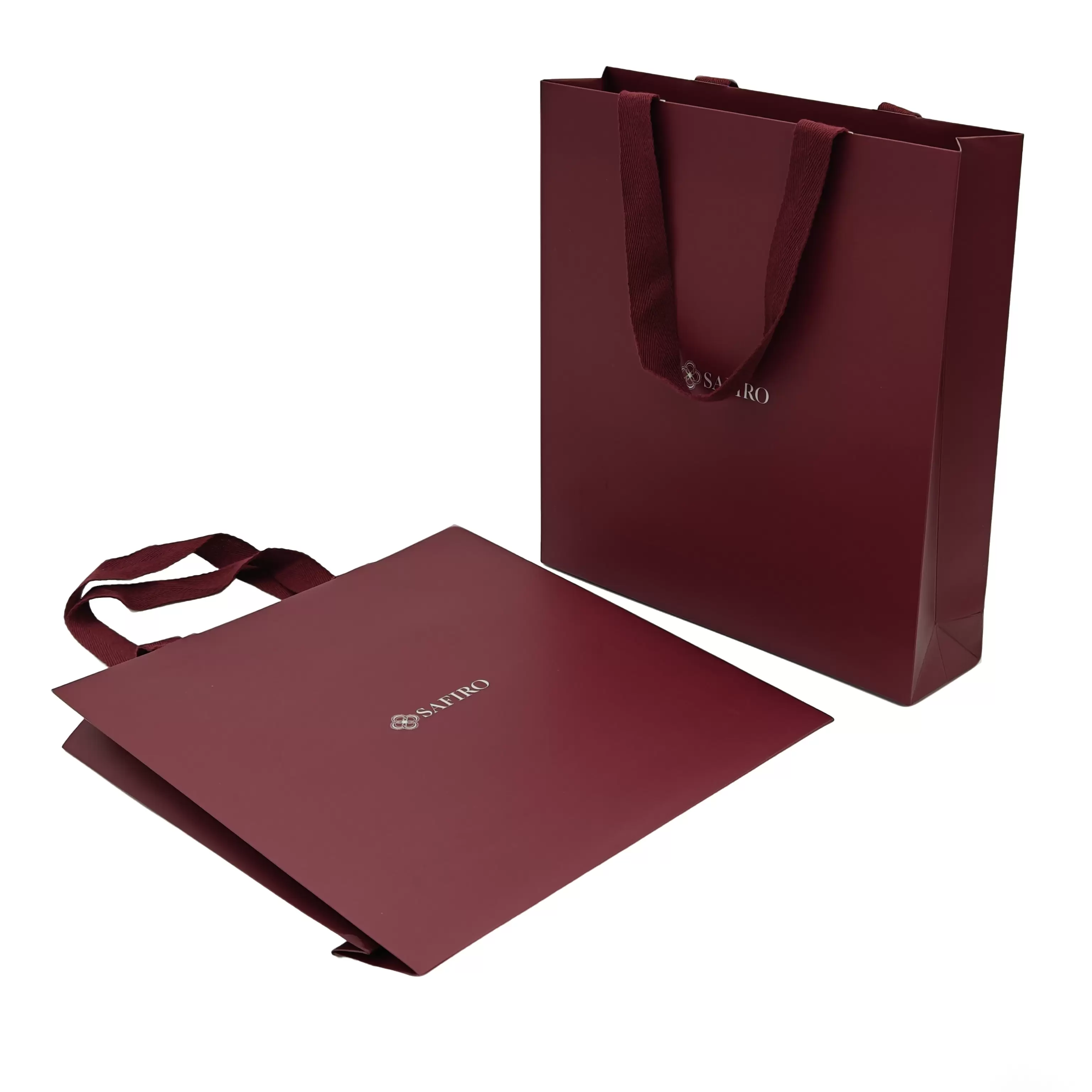 Papieren draagtassen met stoffen handvatten